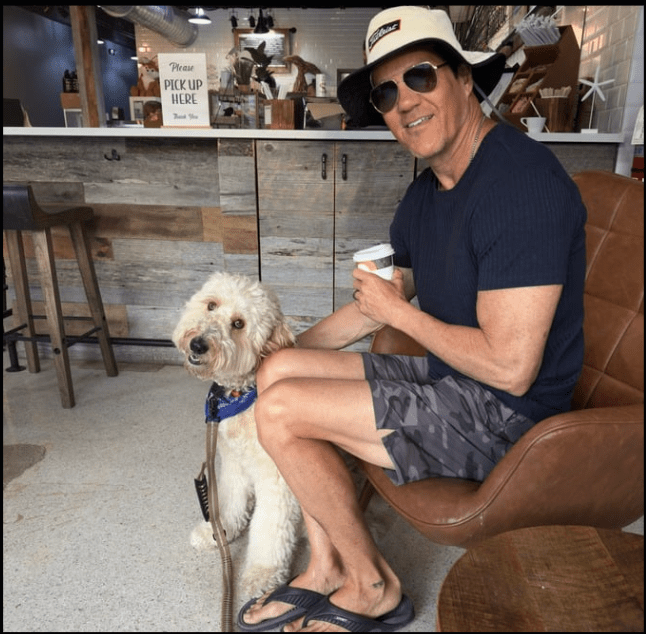 Hollywood the Goldendoodle relaxing outside Foxtail Coffee in Cocoa Beach