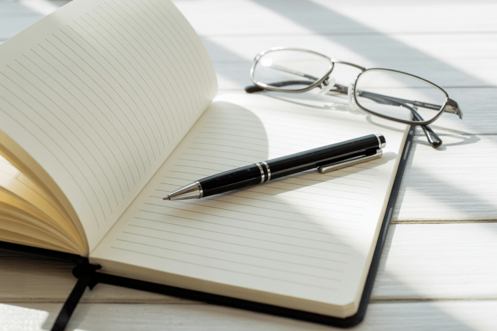 Simple notebook + pen + reading glasses